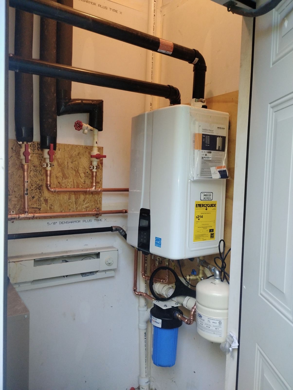 Tankless water heater installation with whole-house filter and copper piping